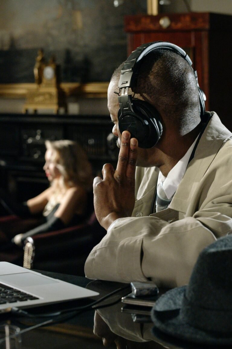 Detective listening through headphones while observing a lounge scene with a woman.